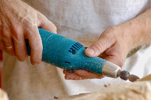 united states person holding blue power tool lock haven